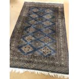 Blue ground rug, approx 240cm x 154cm