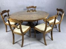 Oval walnut inlaid dining table on scrolling carved pedestal base, with castors and detachable glass