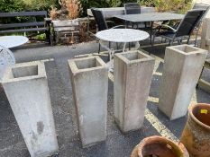 Four modern cast concrete planters, each approx 73cm tall