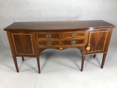 Inlaid Edwardian serpentine-fronted sideboard with two cupboards and four drawers, with original