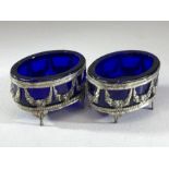 Pair of continental salts with blue glass liners