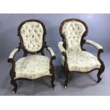 Pair of 'His and Hers' Victorian low upholstered walnut armchairs with carved detailing on