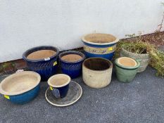 Collection of concrete and ceramic garden pots