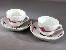 Pair of Meissen Pink Dragon cabinet cups and saucers blue cross swords mark to base