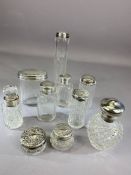 Collection of ten silver topped scent bottles with various hallmarks and ages