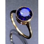 Gold (Unmarked) Dress Ring set with a 92mm diameter Blue Faceted Gemstone Size N½.