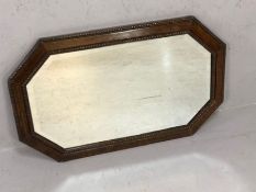 Oak octagonal beaded bevel-edged mirror, approx 77cm x 49cm