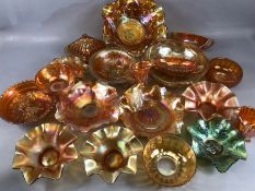 Collection of carnival glass, early 20th century, predominantly in a marigold lustre, circa 21