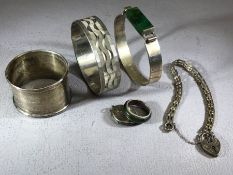 Collection of silver items to include bangles, bracelets and a napkin ring (6)