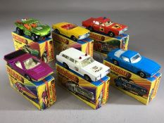 Six boxed Matchbox Superfast diecast model vehicles: 13 Baja Buggy, 14 ISO Grifo, 27 Mercedes 230