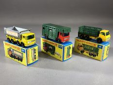 Three boxed Matchbox Series diecast model vehicles: 4 Stake Truck, 17 Horse Box, 51 8 Wheel Tipper