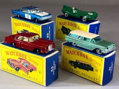 Four boxed Matchbox Series diecast model vehicles: 31 Ford Station Wagon, 41 Jaguar Racing Car, 53