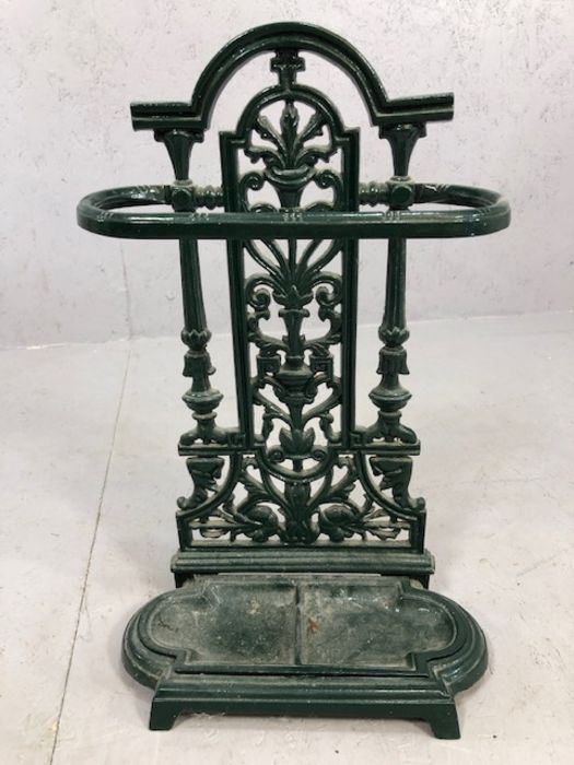Green cast iron umbrella stand with drip tray, approx 53cm in height
