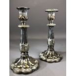 Pair of Silver coloured candlesticks approx 23cm tall A/F