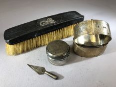 Collection of silver items to include a pair of bangles, silver lidded pot, trowel book mark and a