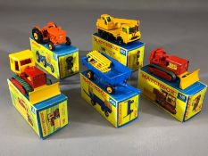 Five boxed Matchbox Series diecast model vehicles: 16 Case Tractor x 2, 39 Ford Tractor, 40 Hay