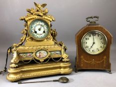 Mid 19th century gilt metal mantel clock with enamelled dial with floral centre, the case topped