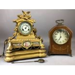 Mid 19th century gilt metal mantel clock with enamelled dial with floral centre, the case topped