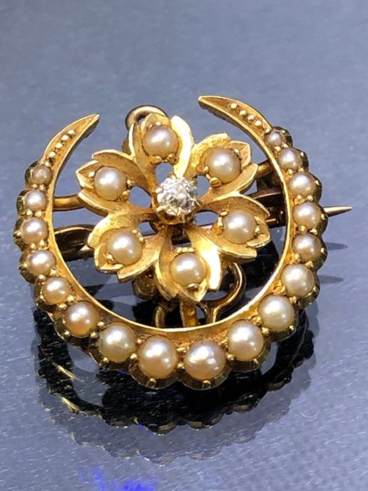 Gold (unmarked but possibly 15ct or 18ct) Small Crescent Brooch set with graduated seed pearls and
