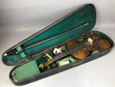 Vintage cased violin marked Stainer, with two bows, one with mother of pearl inlay (A/F)