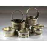 Collection of eight silver hallmarked napkin rings total weight approx 159g