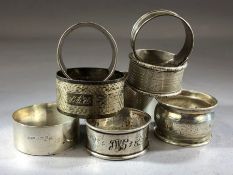 Collection of eight silver hallmarked napkin rings total weight approx 159g