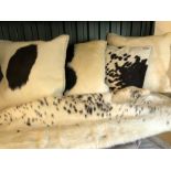 Modern Interiors: Collection of four cow hide cushions and one throw