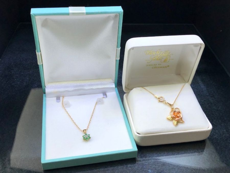 Two Gold Chains (9ct & 10ct) and two pendants (including 10ct rose gold flower) both boxed