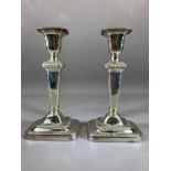 Pair of silver plated candlesticks approx 21cm tall
