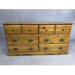Modern pine-effect chest of eight drawers, approx 150cm x 44cm x 78cm tall