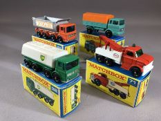Four boxed Matchbox Series diecast model vehicles: 1 Mercedes Truck, 32 Leyland Petrol Tanker, 51