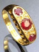 Antique 18ct Gold Ruby and Diamond ring, three Rubies and four diamonds in a pierced setting size '