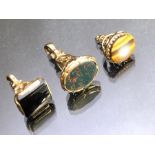Three Hallmarked 9ct Gold Seal / Fobs set with precious stones including tigers eye and blood