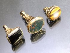 Three Hallmarked 9ct Gold Seal / Fobs set with precious stones including tigers eye and blood