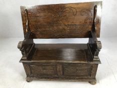 Carved monk's bench with hinged seat and storage under, approx 107cm x 46cm x 63cm tall