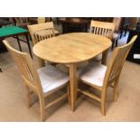 Light wood kitchen extendable table and four suede padded chairs, table approx 105cm x 80cm (