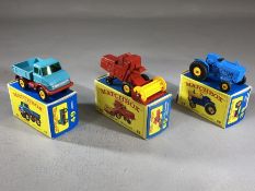 Three boxed Matchbox Series diecast model vehicles: 39 Ford Tractor, 49 Unimog, 65 Claas Combine