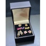 six sets of Gold & gold coloured earrings all set with gemstones