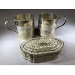 Two Indian silver cups (6.5cm tall) with engraved bird decoration and a similar silver pill pot