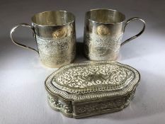 Two Indian silver cups (6.5cm tall) with engraved bird decoration and a similar silver pill pot