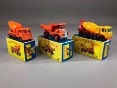 Three boxed Matchbox Series diecast model vehicles: 21 Doden Concrete Truck, 28 Mack Dump Truck,