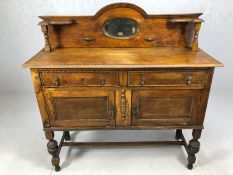Art Nouveau sideboard on turned legs, two drawers, two cupboards, carved beaded detailing and