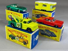 Four boxed Matchbox Series diecast model vehicles: 13 Dodge Wreck Truck, 22 Pontiac G.P. Coupe, 23