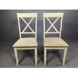 Pair of modern white painted chairs with cream faux suede seat pads