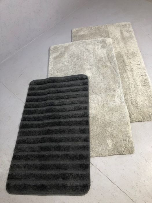 Two modern grey rugs and one other, the pair approx 150cm x 80cm