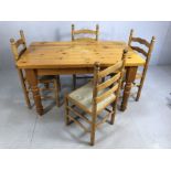 Pine kitchen table on turned legs, approx 136cm x 80cm x 76cm tall, accompanied by four ladder