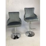 Pair of kitchen island bar stools on chrome bases with grey leather upholstery, fully adjustable