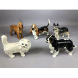 Collection of four Beswick dogs (King Charles Spaniel, Ulrica of Brittas, Basset Hound and Cocker