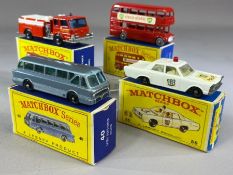 Four boxed Matchbox Series diecast model vehicles: 5 Routemaster, 29 Fire Pump Truck, 40 Long