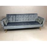 Blue grey velvet button back three seater sofa bed, folds to create small double bed, approx 200cm